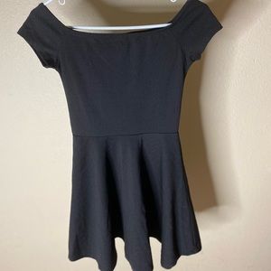 Cute off the shoulder black dress, can be dressed up or down. Size 12.